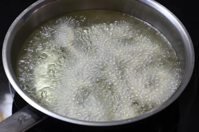 frying butter murukku in oil