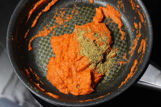 adding garam masala