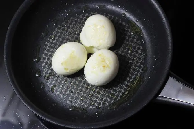 frying eggs for egg butter masala