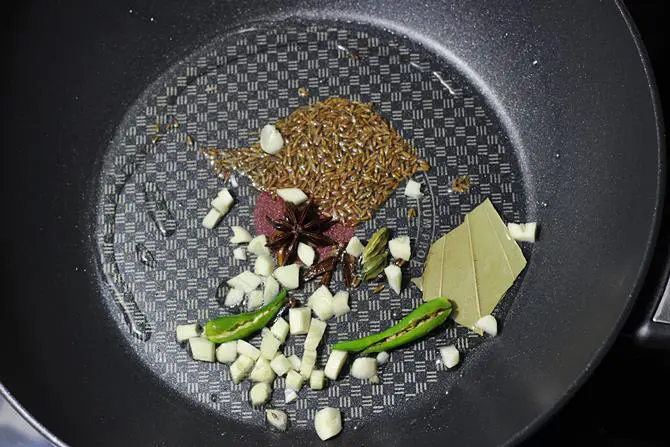 saute spices to make palak rice recipe