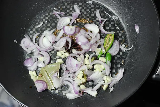 fry onions till pink to make palak rice