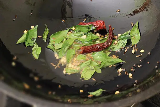 frying curry leaves for steamed cabbage curry