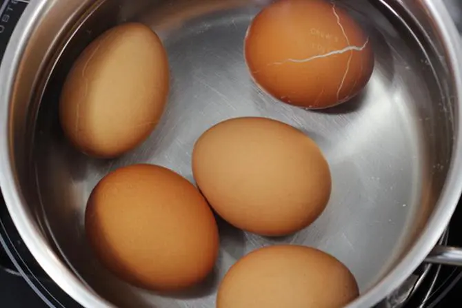 boiling eggs in pot for egg curry