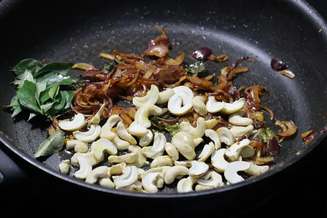 add curry leaves, cashews and raisins
