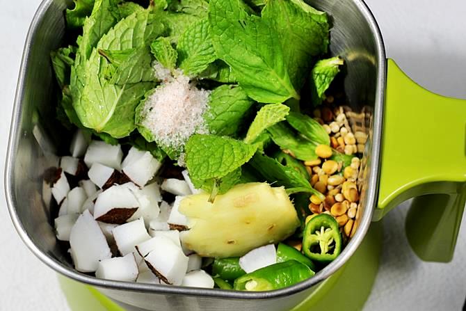 blending ingredients in a blender to make pudina chutney