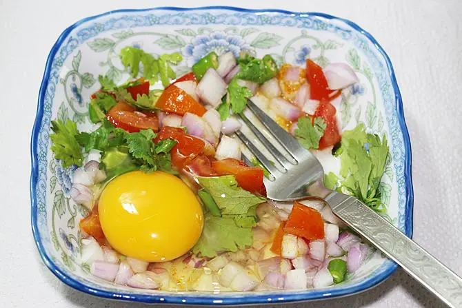 beat egg with veggies for egg toast