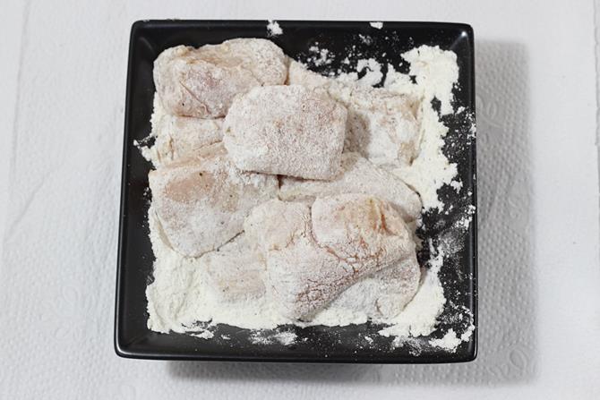 coating marinated chicken in seasoned flour
