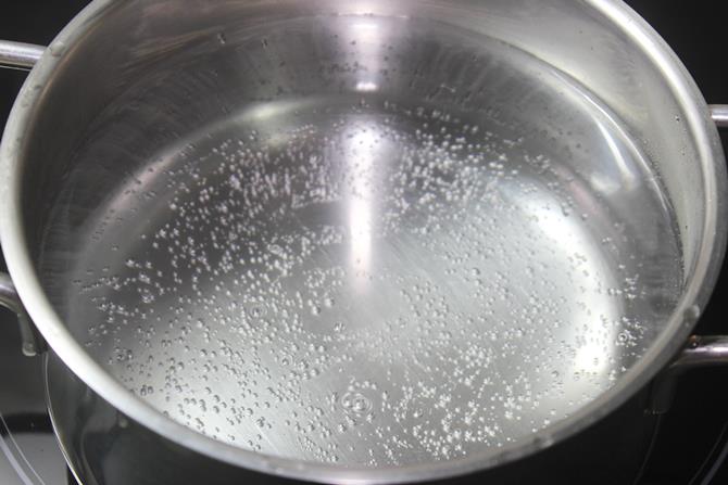 boiling water to cook noodles