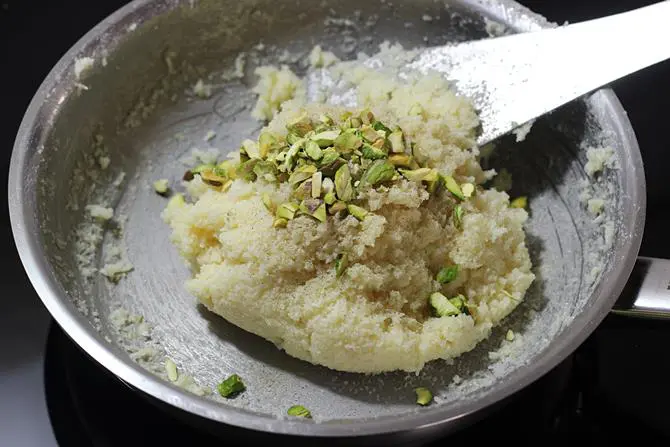 addition of cardamom powder nuts to make coconut balls