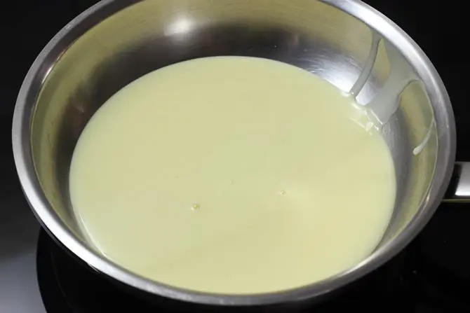 addition of milk to make coconut ladoo with condensed milk