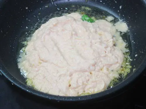 cooking ground puree to make dum aloo recipe