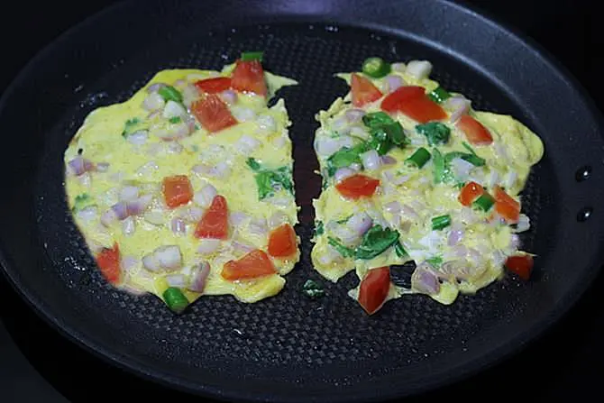 frying eggs on pan for egg toast