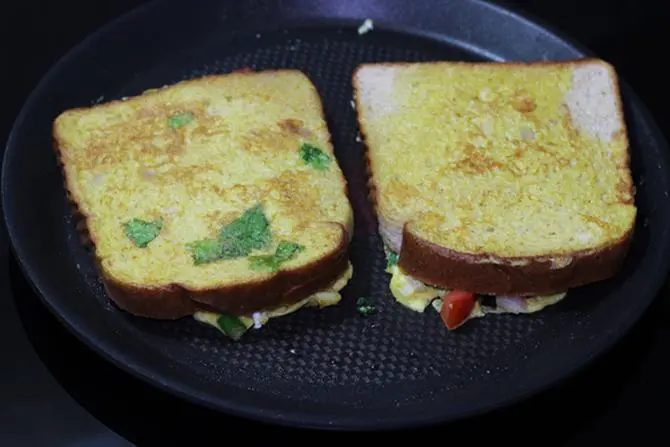 press egg toast with spatula