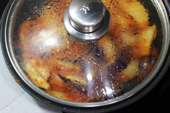 cooking on a low heat aloo baingan masala