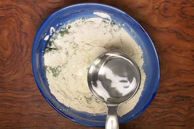 pouring water to make instant mysore bonda batter