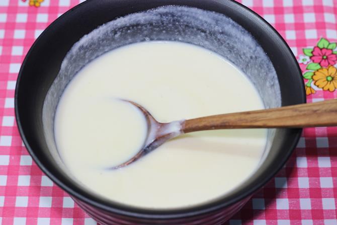 stirring whipped cream with condensed milk