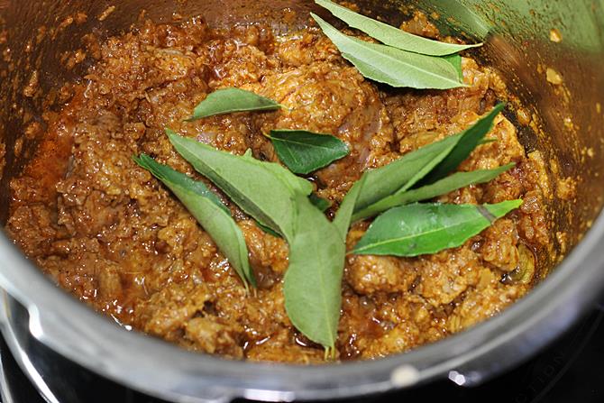 addition of curry leaves to make mutton curry gravy