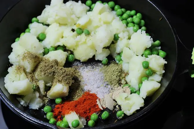 sauteing spices to make samosa filling