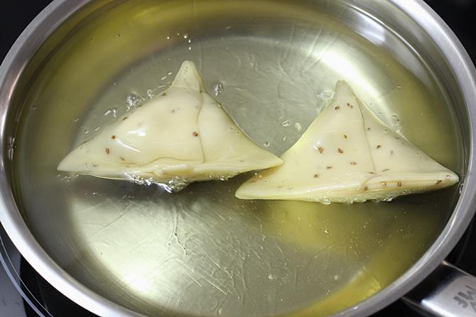 frying samosa in oil