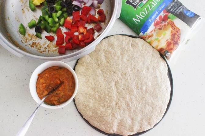spread pizza dough