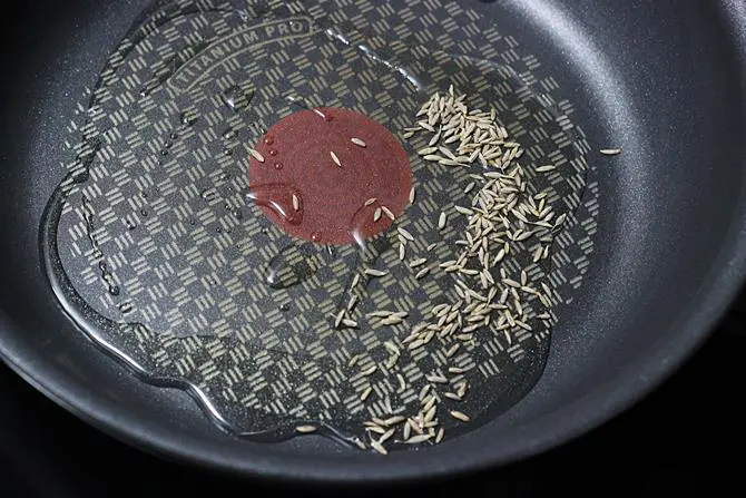 sauteing cumin to make chana paneer recipe