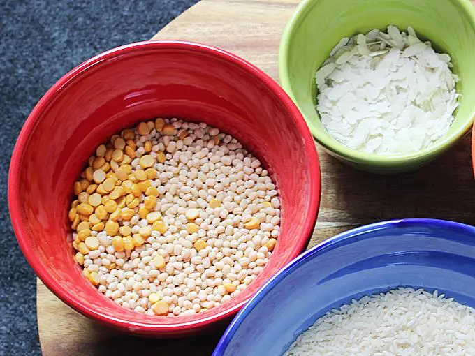 measuring urad dal poha to make masala dosa