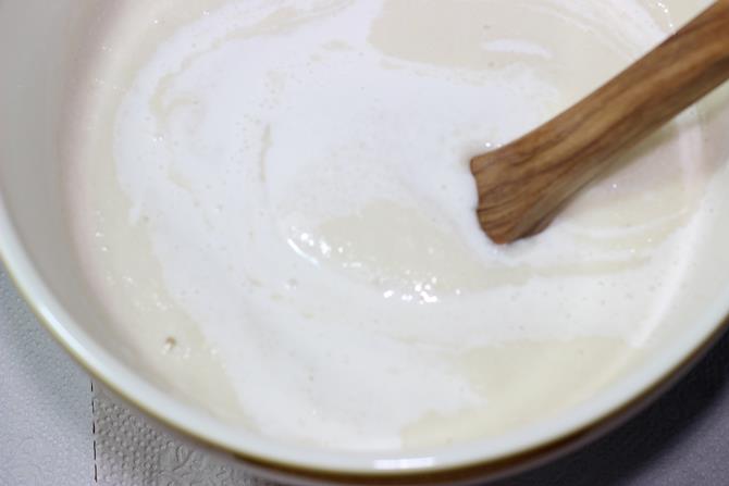 mixing rice dal batter to make masala dosa