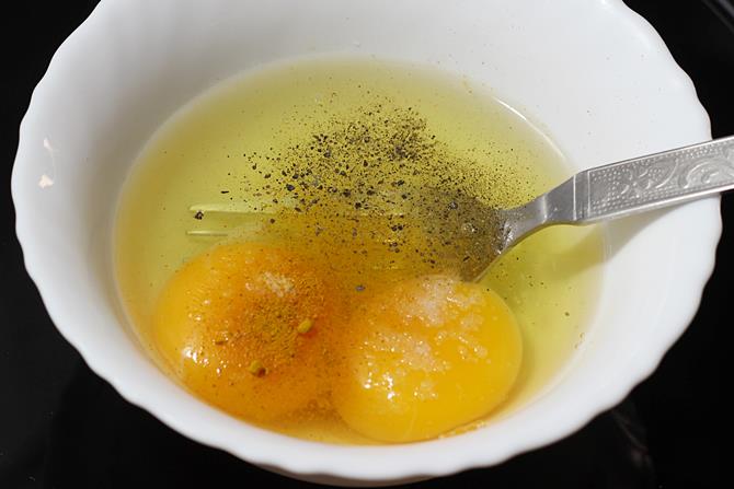 break eggs to a bowl to make mushroom omelette