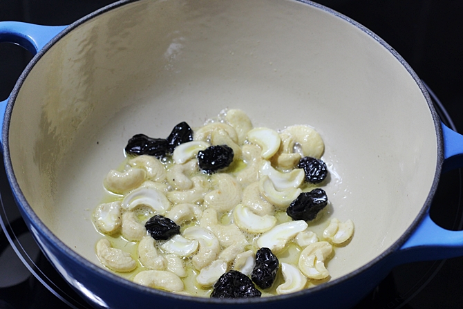 Heat ghee or butter in a pot and fry cashews