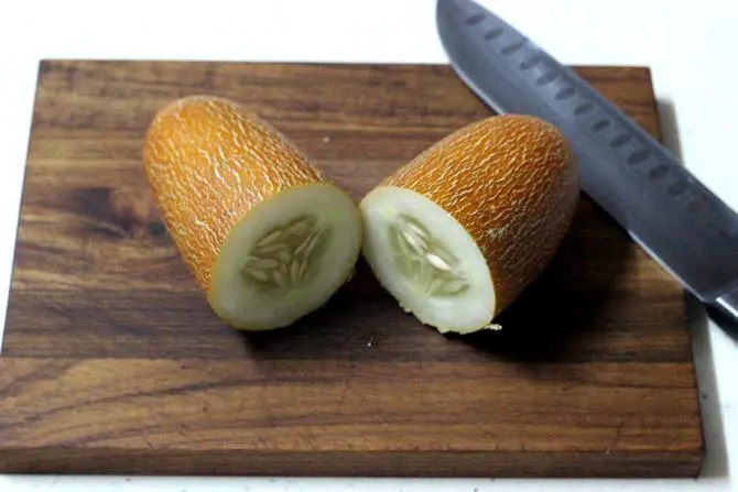 chopping cucumber for dosakaya pickle recipe