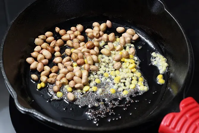 Fry peanuts until golden