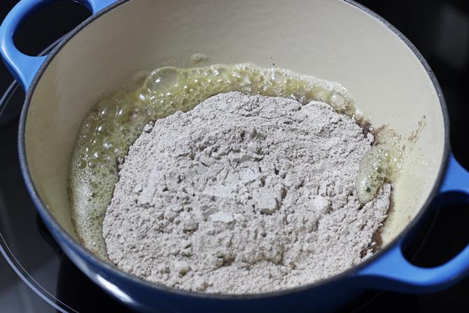 frying flour to make nachni halwa recipe