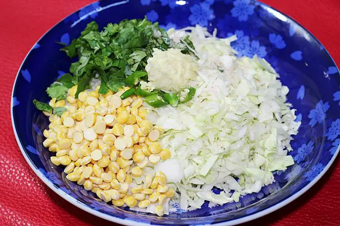 add ingredients to bowl to make cabbage vada
