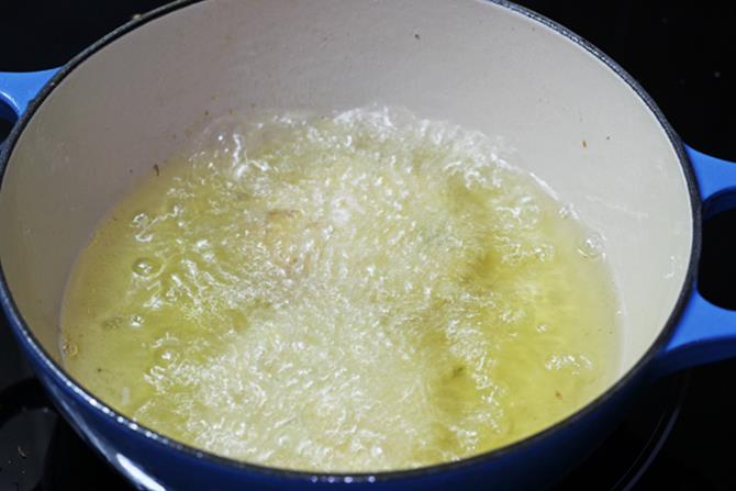 shaping vadai to make cabbage vada recipe