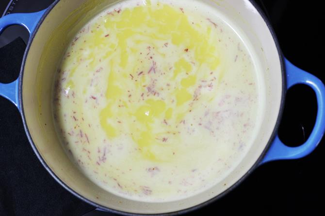 boiling milk to make milk kesari