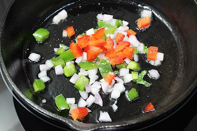 sauteing veggies for cheese omelette