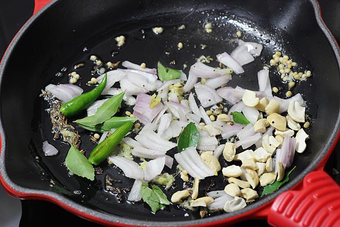 frying onions to make vegetable bonda