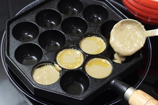 Fill the moulds with batter