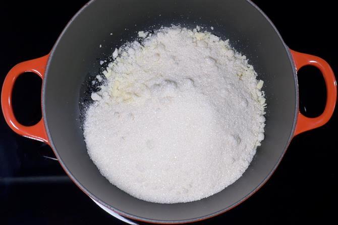 addition of sugar to make coconut barfi recipe