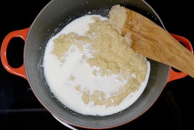 addition of milk to make coconut barfi recipe