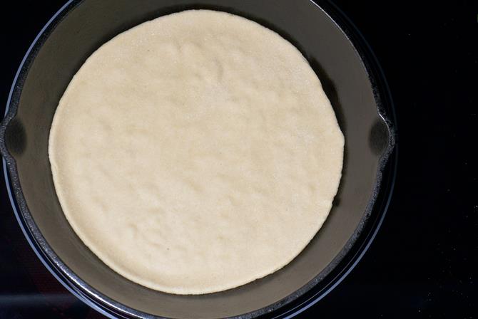 Heat the tawa