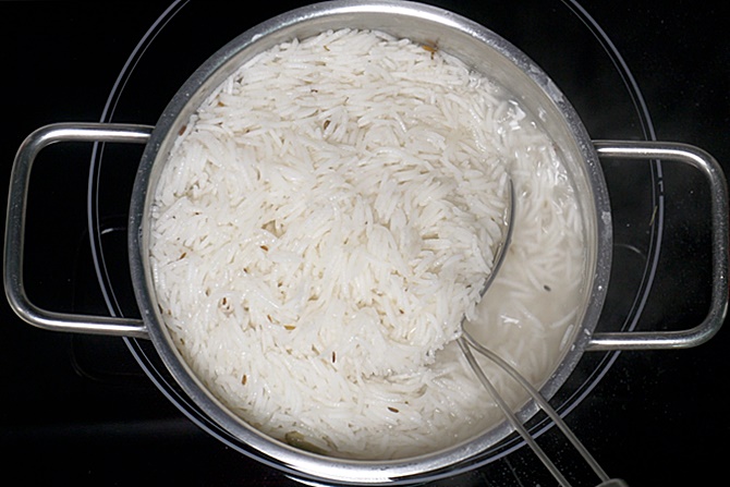draining cooked biryani rice