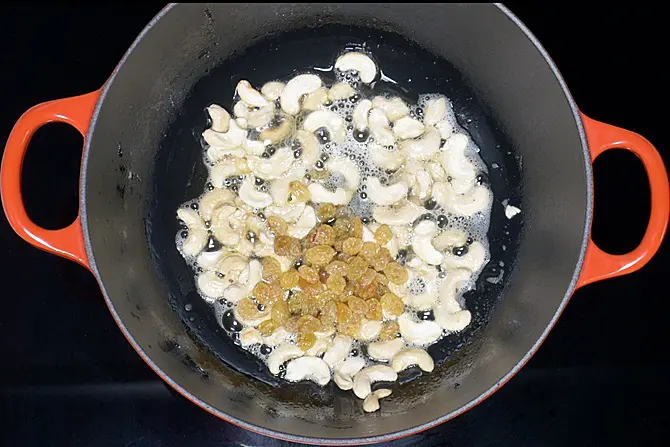 Fry cashews until lightly golden