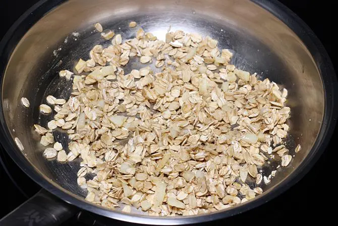 adding oats to make soup