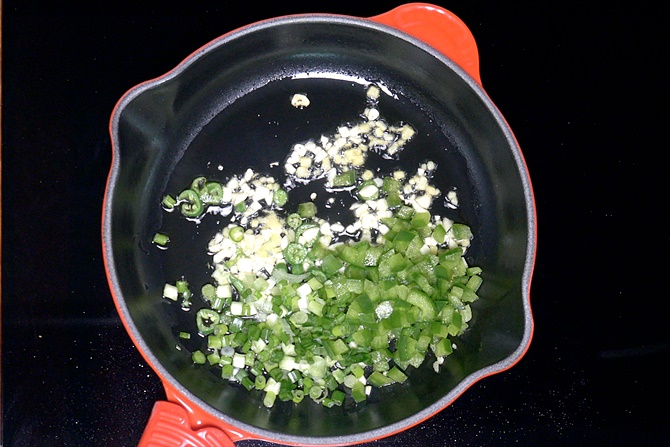 frying spring onions and capsicum