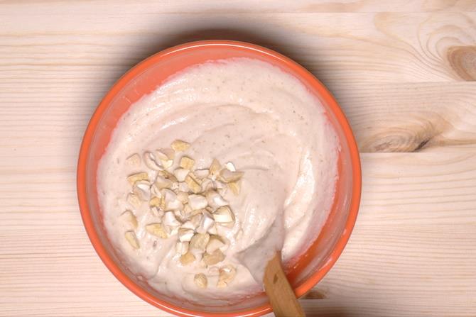 adding cashews to dahi vada batter
