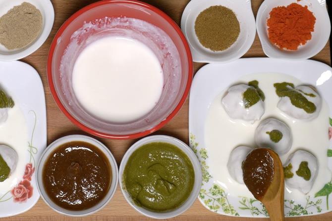 adding sweet sour and hot chutney over dahi vada