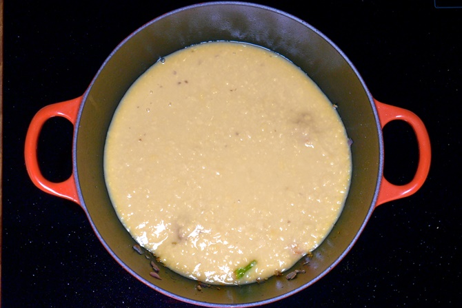 pouring dal to pan to make dal fry