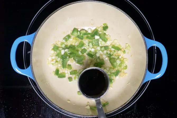 pouring soya sauce for manchurian recipe