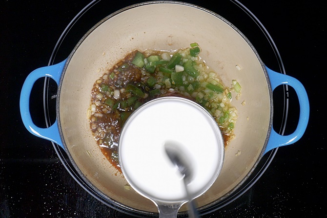 stirring corn flour to make manchurian